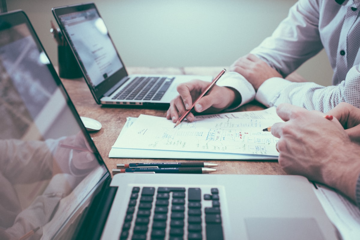 Planning documents and a pen being reviewed for an income tax return