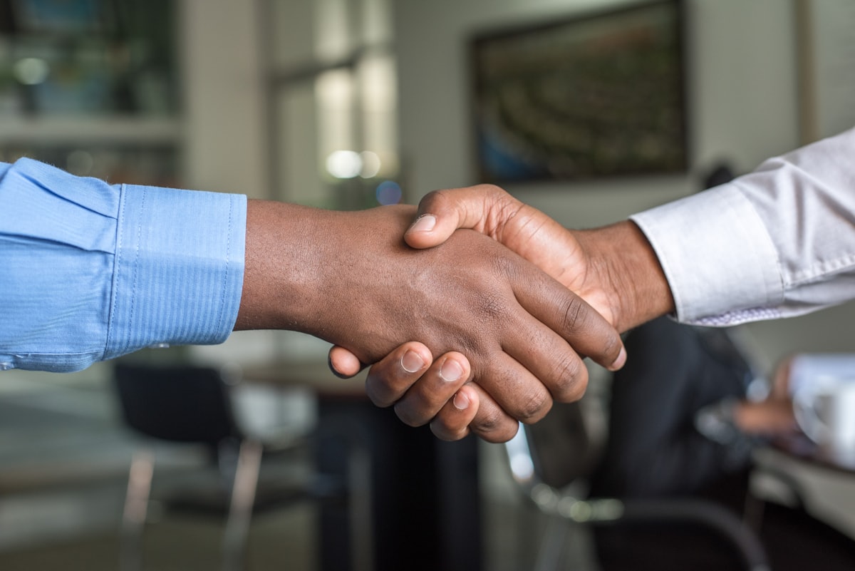 A handshake closing a new business partnership