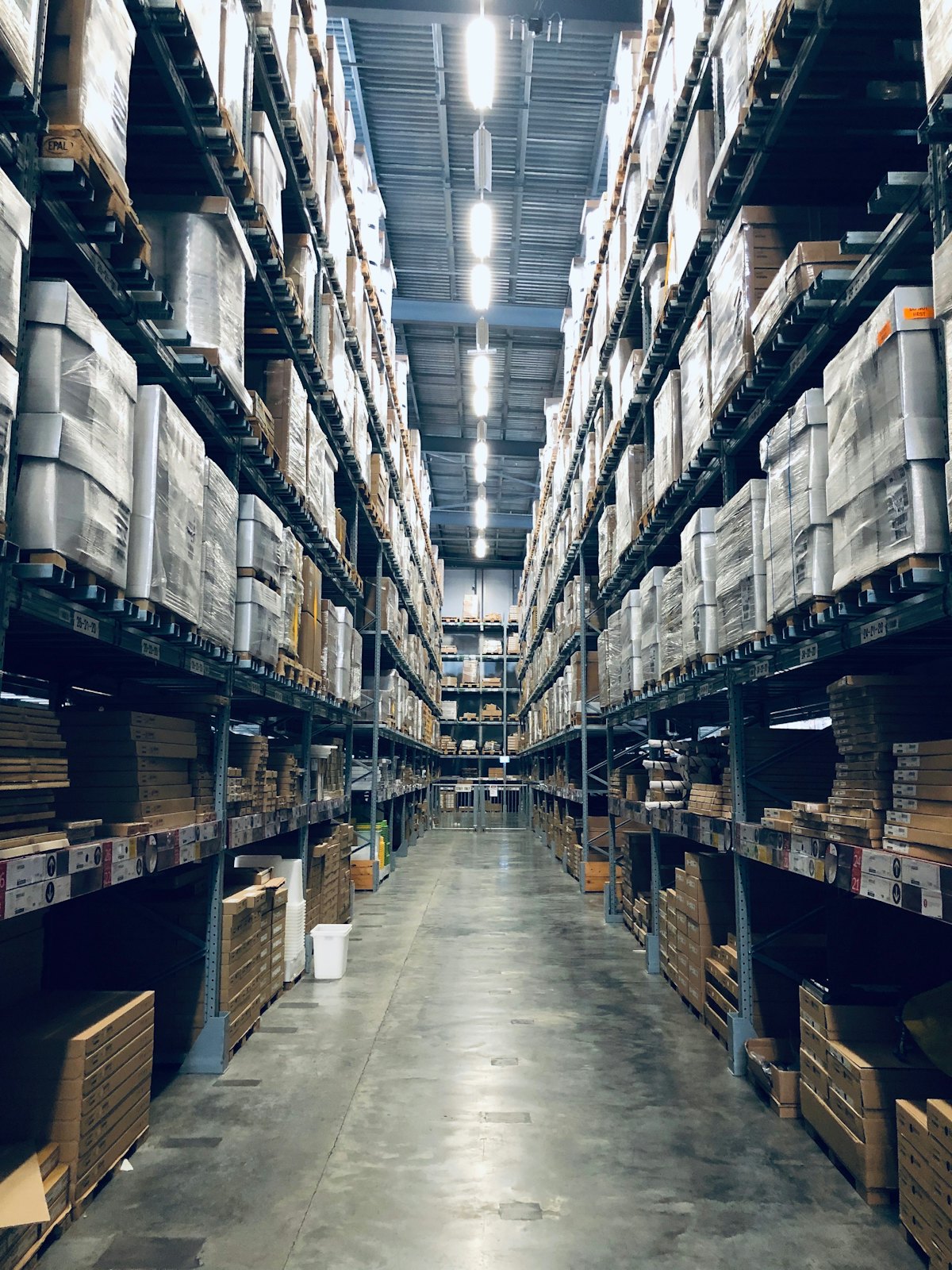 Warehouse aisles being inspected during a stock audit